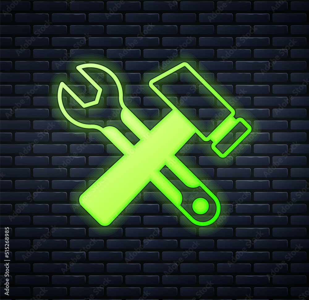 Glowing neon Crossed hammer and wrench spanner icon isolated on brick wall background. Hardware tools. Vector Glowing neon Crossed hammer and wrench spanner icon isolated on brick wall background. Hardware tools. Vector
