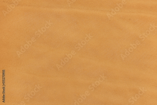  Leather. Close up beige color suede texture background 