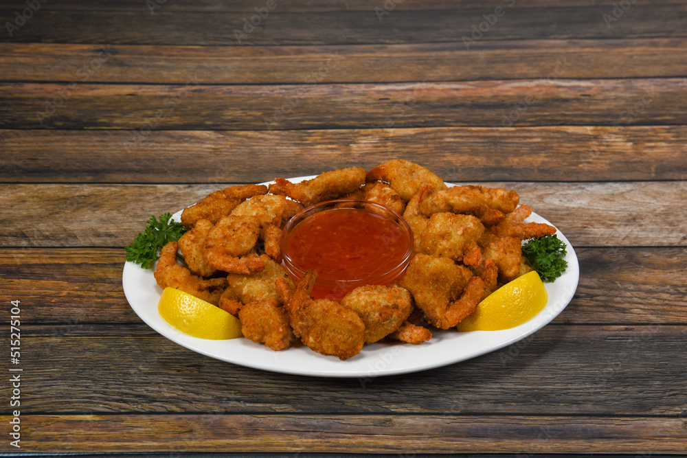 A plate of delicious golden fried shrimp. A plate of delicious golden fried shrimp.