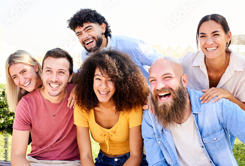 Cheerful Group of friends posing for a photo and having fun. Friendship and community concept © CarlosBarquero