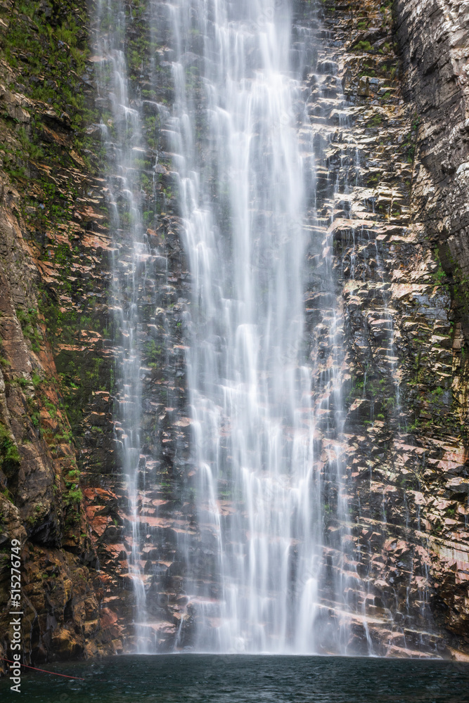 Beautiful view to big wild rocky waterfall on green area Beautiful view to big wild rocky waterfall on green area