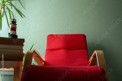 open book on a red armchair photo