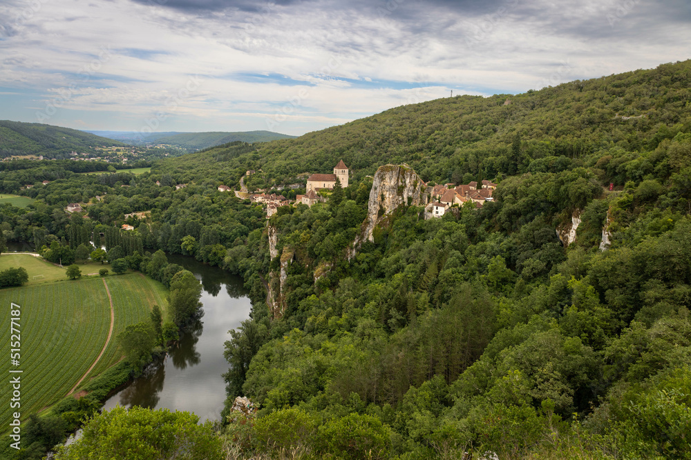 Panoramic view of Saint Cirq la popie with a forest and a river. Medieval village. Most beautiful villages in France