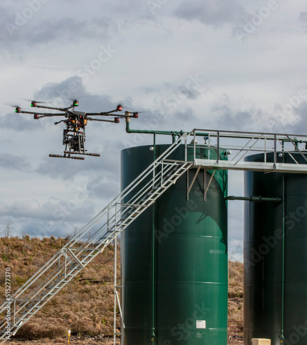 Drone inspects for methane leaks on well site photo