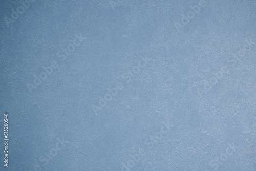 detalle de cobertura de agenda de plástico azul cielo con textura de puntos