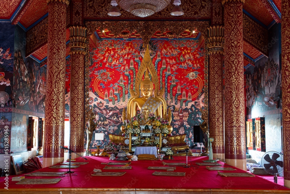 The golden sitting Buddha is main in a Church at Wat Phra That Choeng Chum Worawihan It is an important sacred place of the house. City partner since ancient times.