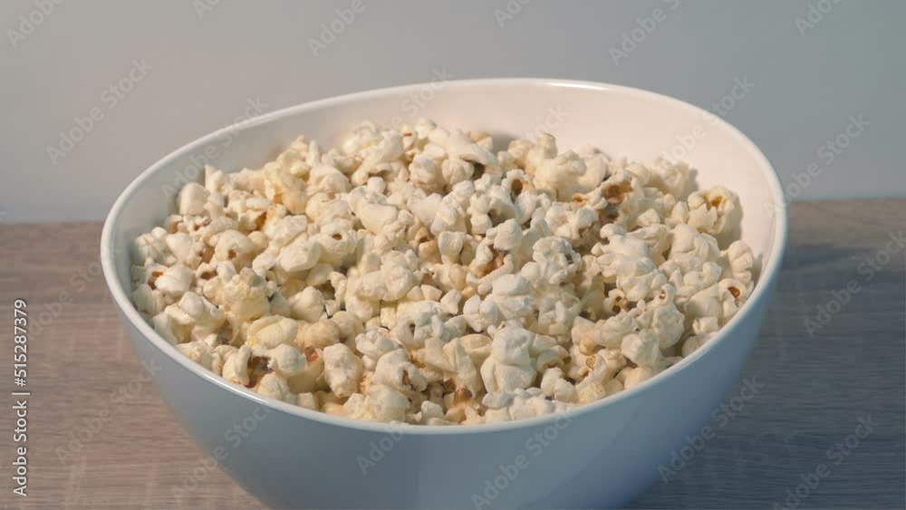Bowl Of Popcorn Put Down Or Picked Up Off Table
