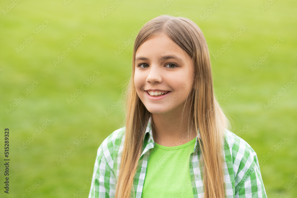 Portrait of happy teenage girl with smiling face blurry outdoors Portrait of happy teenage girl with smiling face blurry outdoors