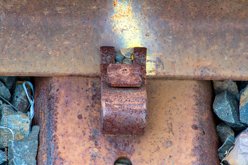 Close-up of railroad tie holding track to sleepers on an old railway line Close-up of railroad tie holding track to sleepers on an old railway line