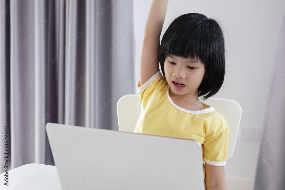 little asian girl student study online using laptop computer at home little asian girl student study online using laptop computer at home