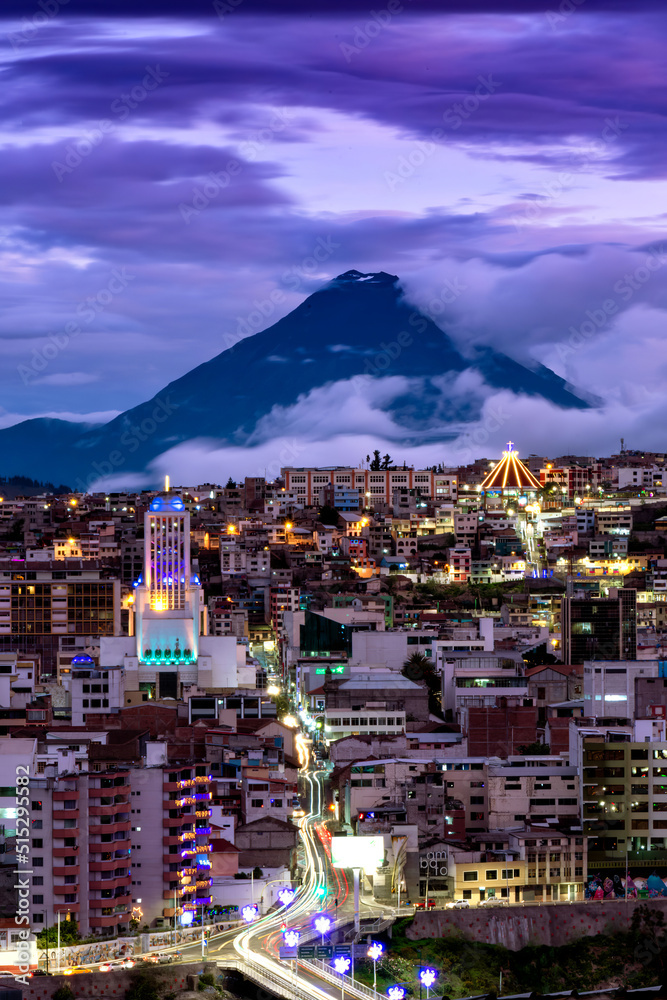 City in the background active volcano at night