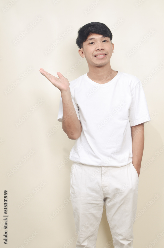 portrait of a man wearing a white t-shirt showing empty space portrait of a man wearing a white t-shirt showing empty space