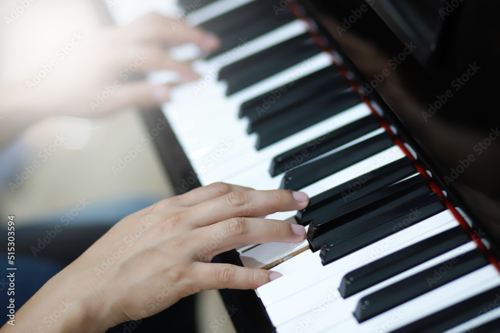 Close up of man playing on piano keyboard Close up of man playing on piano keyboard