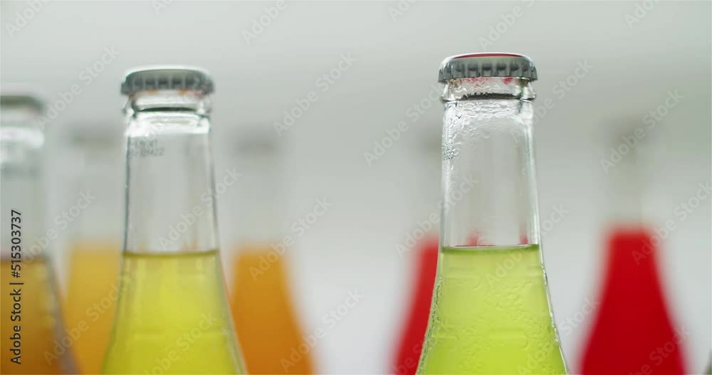 Several bottles of different flavours  soft drinks going around