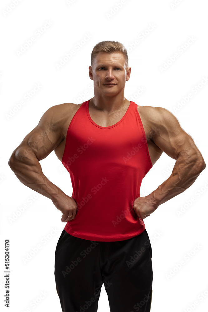 Attractive athlete posing in tank-top in white background Attractive athlete posing in tank-top in white background