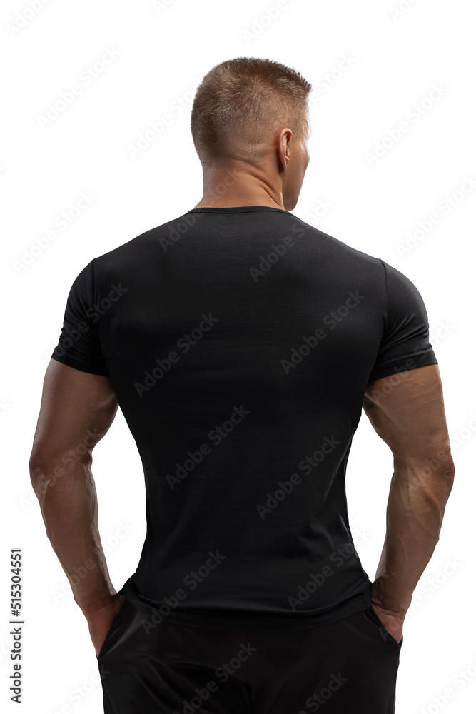 Handsome athletic man posing in T-shirt on a white background Handsome athletic man posing in T-shirt on a white background