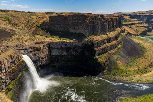 powerful and beautiful Palouse Falls dropping its powerful water in a basin  in Snake River along a canyon in east Washington.