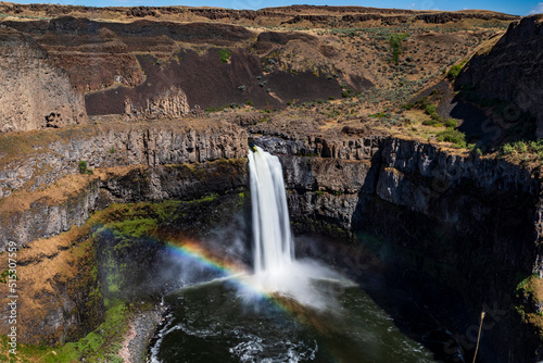 powerful and beautiful Palouse Falls dropping its powerful water in a basin in Snake River along a canyon in east Washington.