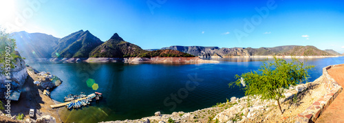 panoramic of dam at morning with mountains in the background and touristic pier , in zimapan hidalgo 