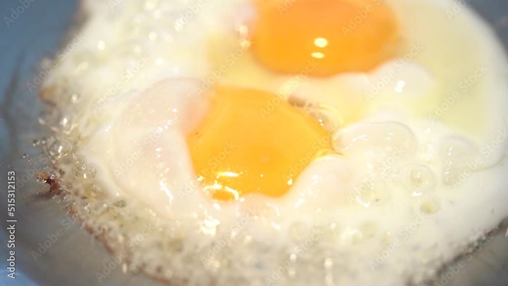Asian Thai Style Fries Egg in Oil Iron Wok - Macro Close Up Asian Thai Style Fries Egg in Oil Iron Wok - Macro Close Up