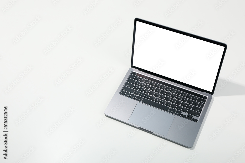 Laptop with blank screen on light background Laptop with blank screen on light background