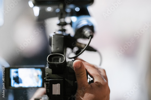 Television camera at an evening press conference © Microgen