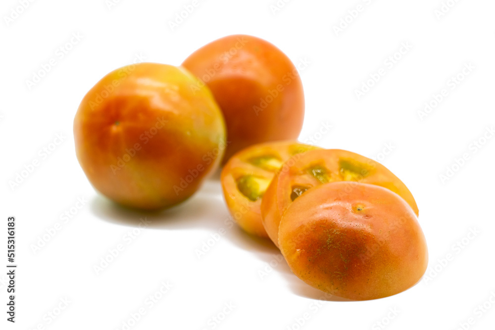 Whole and slices Tomatoes isolated on white background, organic vegetable. Whole and slices Tomatoes isolated on white background, organic vegetable.