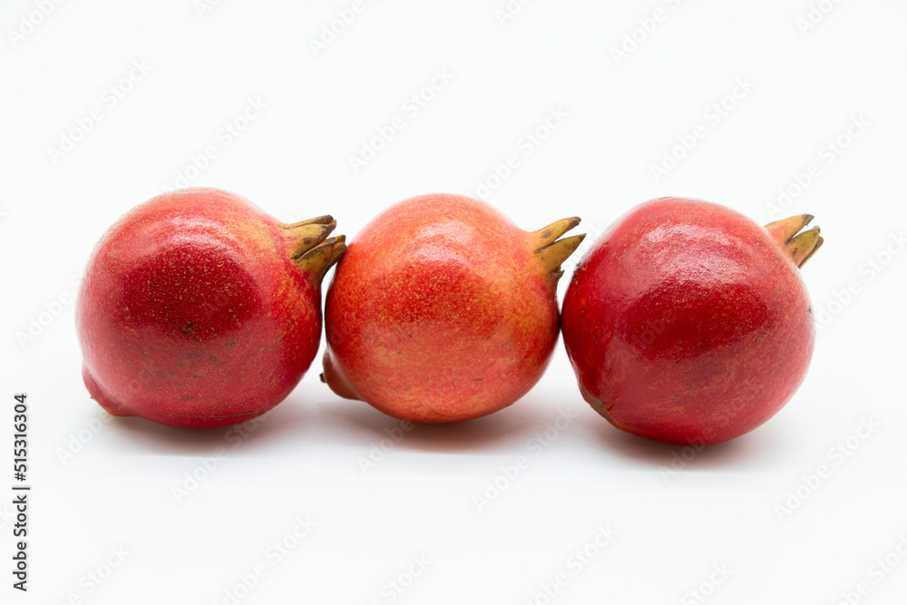 Fototapeta premium whole pomegranate isolated on white background