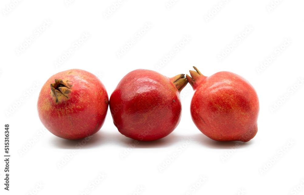 Fresh whole pomegranate closeup isolated on white background. Fresh whole pomegranate closeup isolated on white background.