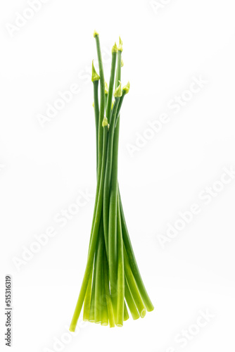 Fresh garlic chives close up over on white background