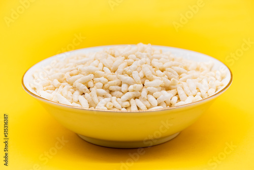 Canvastavla Puffed rice, Churmure or murmure or moori isolated on yellow background