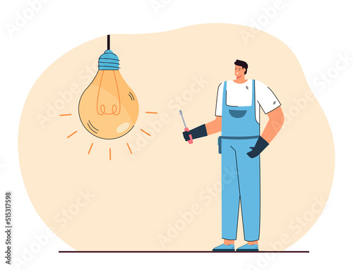 Happy mechanic standing next to huge lightbulb. Man in uniform repairing or changing bulb flat vector illustration. Repair service, maintenance concept for banner, website design or landing web page