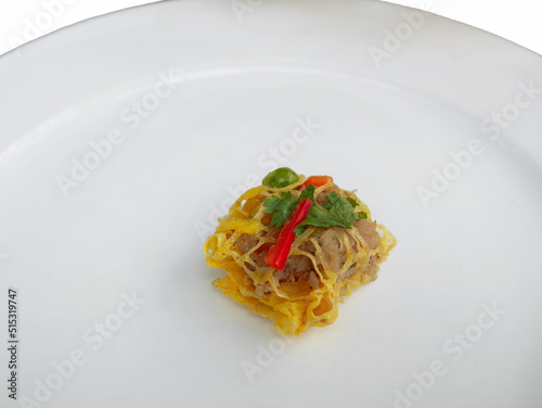 leaetiyong thai tradition signature royal cuisine dish egg wrapped insert with pork and shripm paste sweet taste on white plate photo