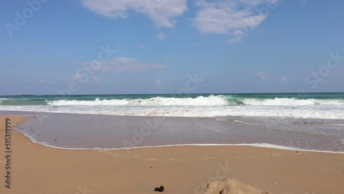 The beach of Atlit - Israel. White sands against the backdrop of a wavy sea photo