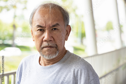 Fotografie Angry asian senior man staring at you