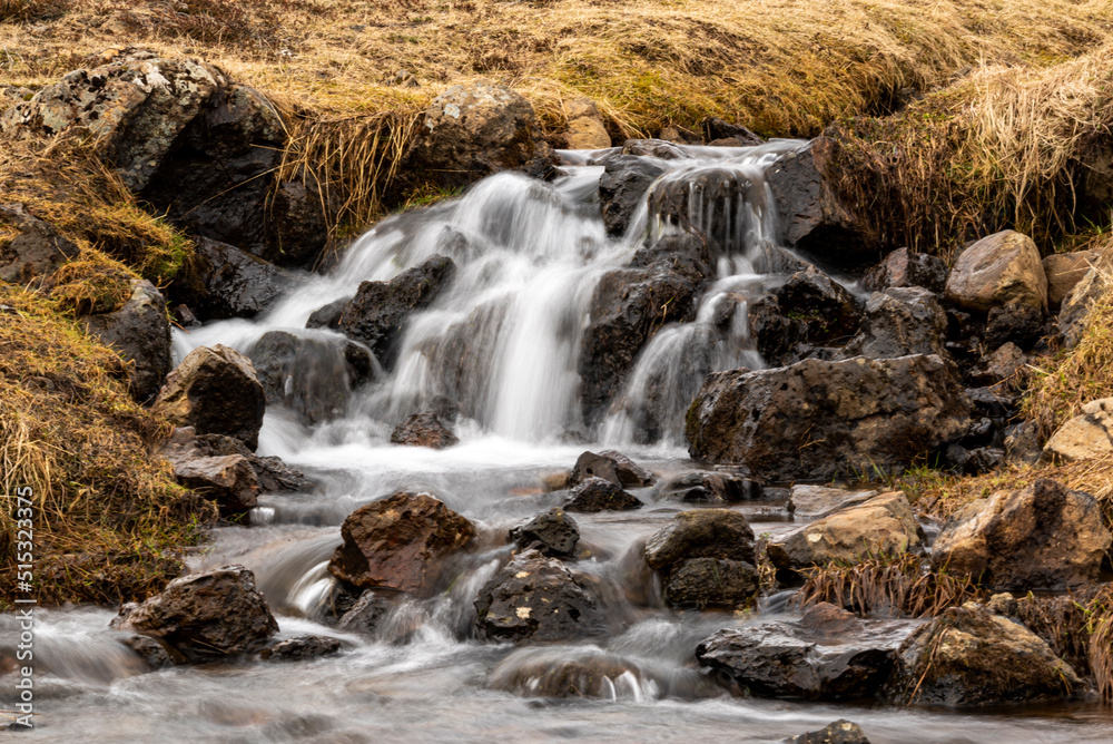 Close-up of a picturesque stream in Reykjadalur valley, along a popular hiking trail, near Hveragerði, Iceland Close-up of a picturesque stream in Reykjadalur valley, along a popular hiking trail, near Hveragerði, Iceland