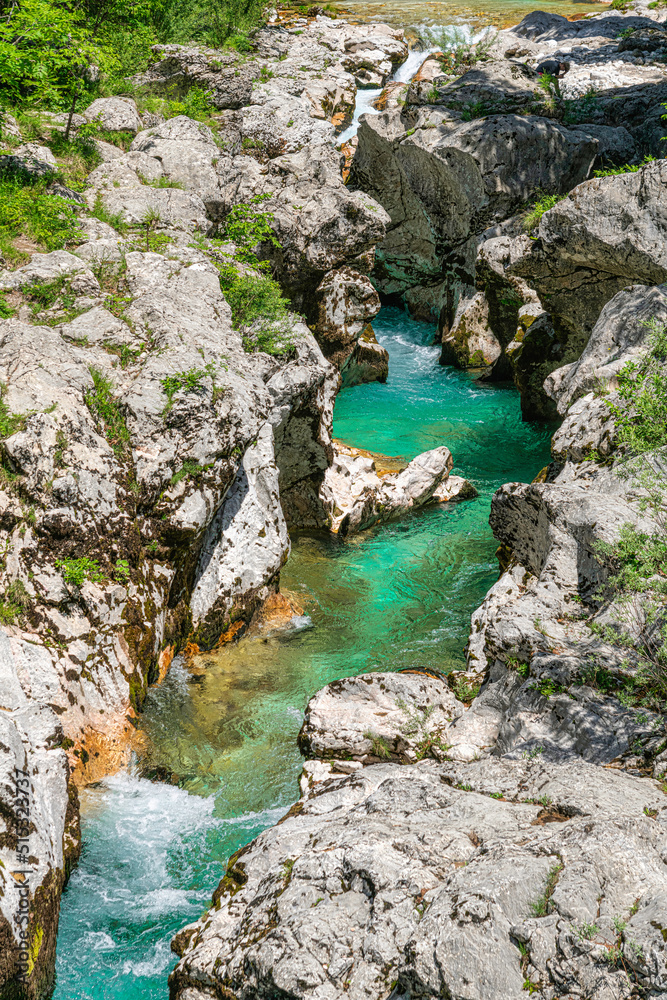 Velika korita Soče in the The Great Soča Gorge, Beautiful gorge with emerald coloured water flowing between the uniquely formed rocks, Triglav National Park, Julian Alps, Slovenia, Europe Velika korita Soče in the The Great Soča Gorge, Beautiful gorge with emerald coloured water flowing between the uniquely formed rocks, Triglav National Park, Julian Alps, Slovenia, Europe