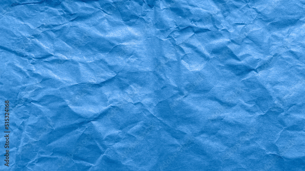Fototapeta premium Abstract background: blue crumpled paper