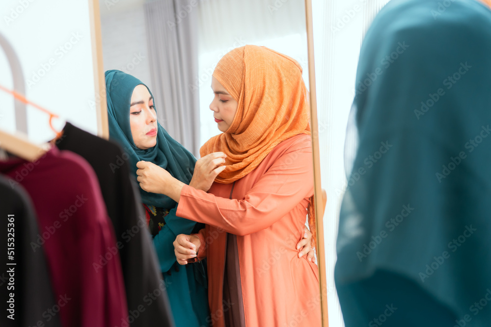 Muslim dressmakers working on their new collection.