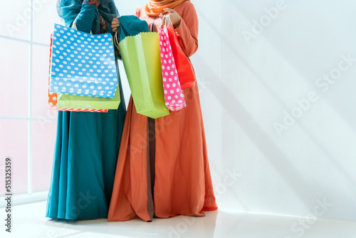 Islamic women friends shopping together on the weekend.