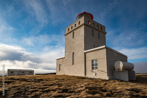 Low angle view of the famous Dyrh  laeyjarviti lighthouse on Dyrh  laey peninsula under a dramatic sky  Iceland  near V  k    M  rdal and Route 1   Ring Road