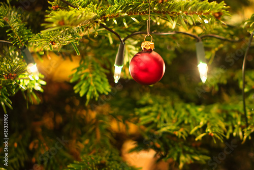 Christmas. Christmas decoration. red christmas ball hanging on christmas tree photo