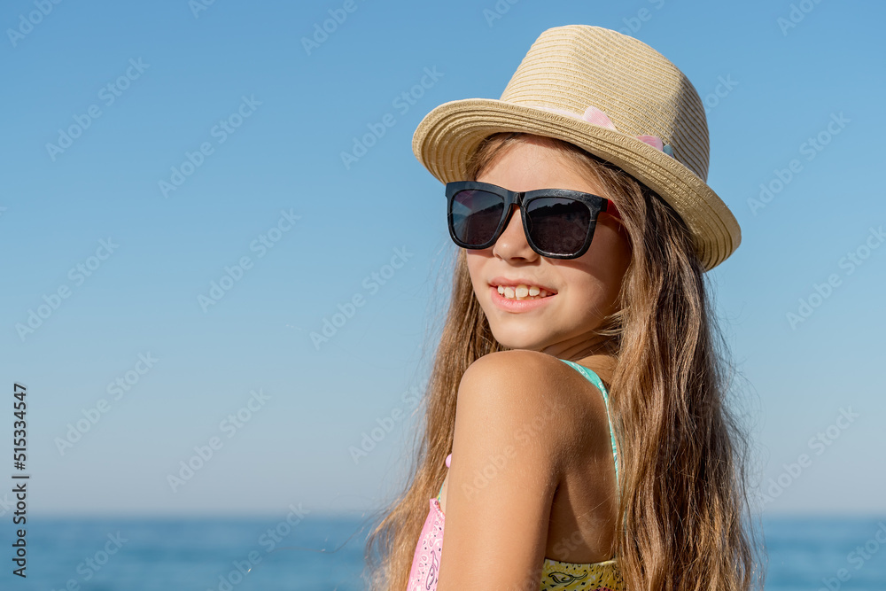 Portrait of a pretty smiling teenage girl on the background of the sea. Portrait of a pretty smiling teenage girl on the background of the sea.