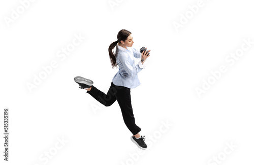 In a hurry. Portrait of employee, business woman drinking coffee in a run isolated over white studio background