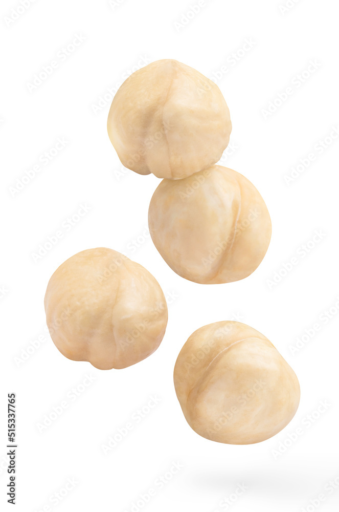 Flying purified hazelnuts, isolated on white background Flying purified hazelnuts, isolated on white background