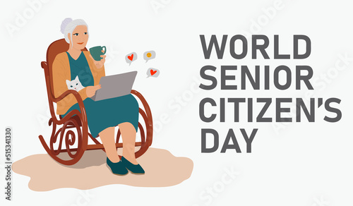 World Senior Citizen's Day. Happy grandmother with the laptop computer