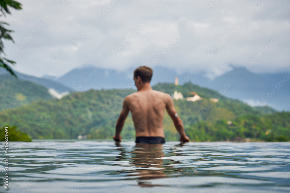Φωτογραφία Diabetes patient in a swimmingpool with an waterproof CGM (Continuous Glucose Monitor) device to measure real-time blood sugar for a healthy lifestyle without setbacks for a good healthcare