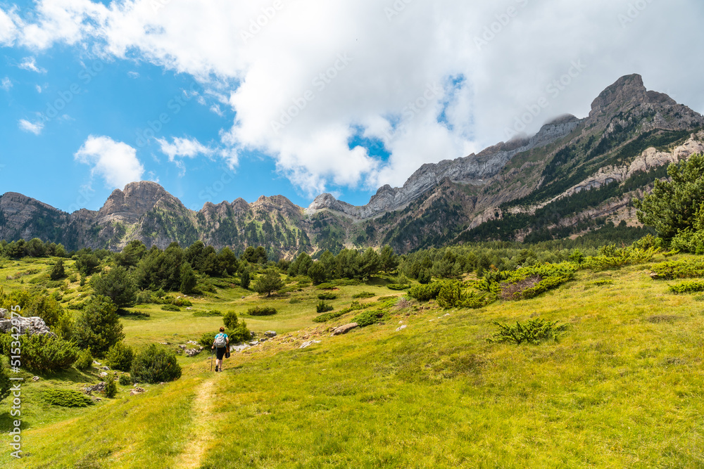 A young woman on the trek going up the mountain to the Piedrafita arch, Alto Gallego, Huesca, Aragon