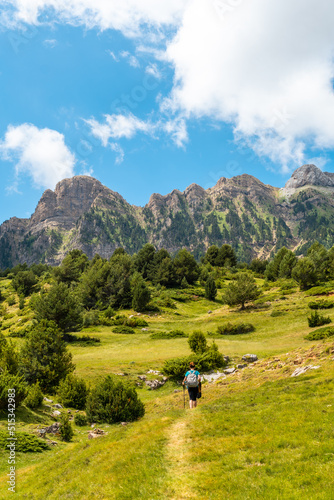 A young woman on the trek going up the mountain to the Piedrafita arch, Alto Gallego, Huesca, Aragon