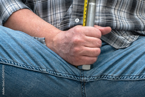 Measurement of penis size by a man. Photo for medicine and psychology